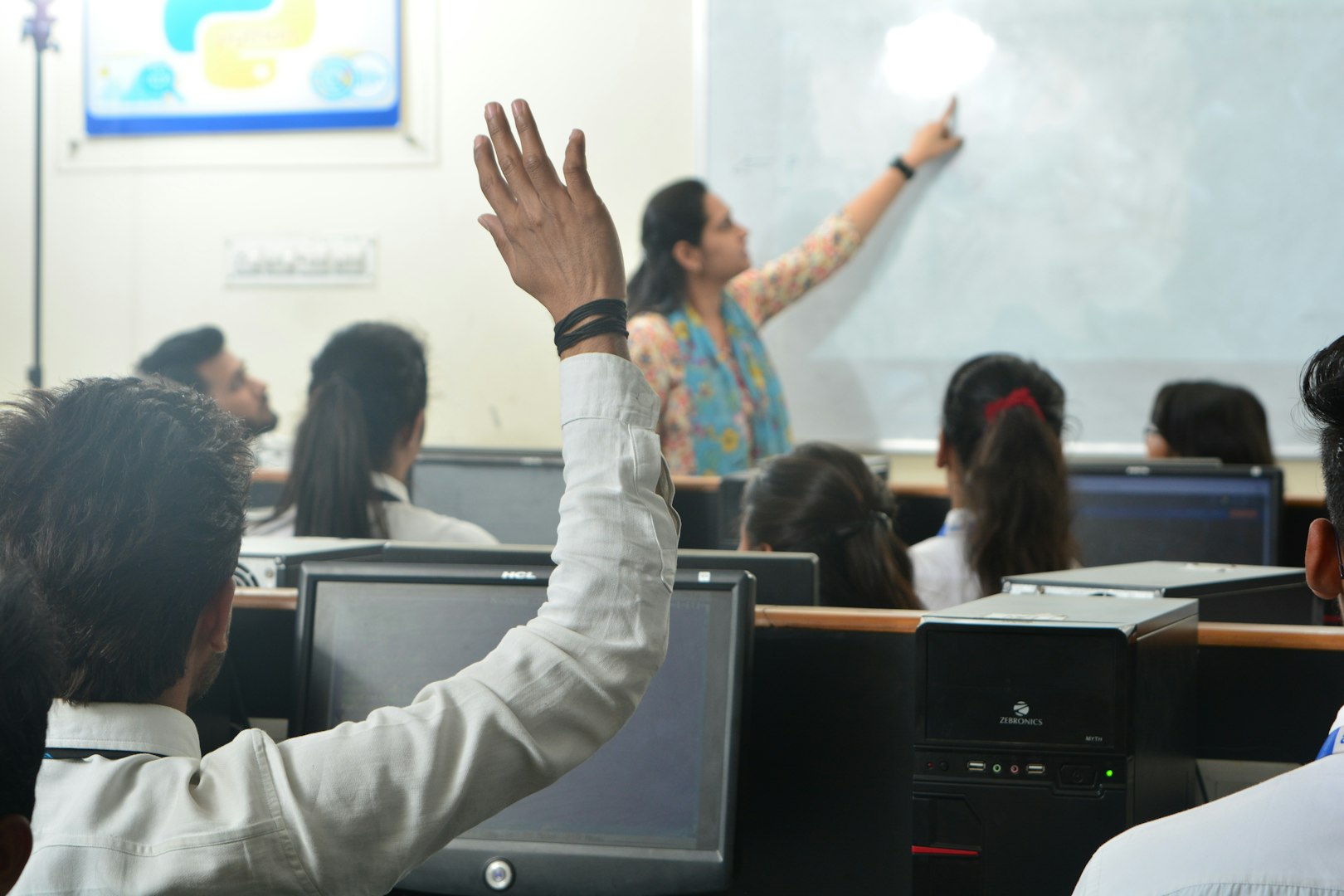 Students and teacher in a computer classroom.